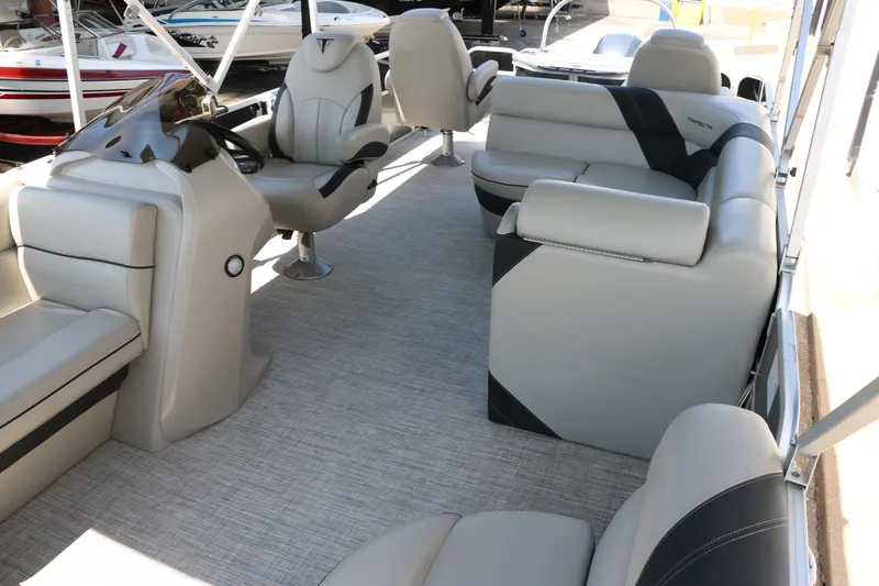 Slide: The Image of Luxurious interior of 2021 Trifecta 24 RFC pontoon boat with plush seating. - 15