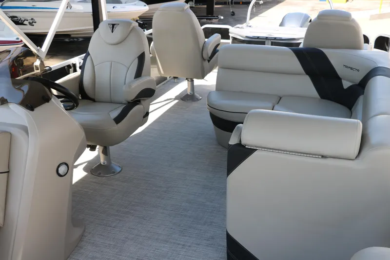 Slide: The Image of 2021 Trifecta 24 RFC boat interior with plush seating and modern design. - 17