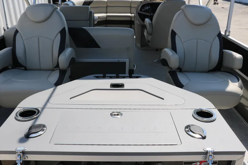 Slide: The Image of Interior of 2021 Trifecta 24 RFC pontoon boat with luxurious seating and table setup. - 20