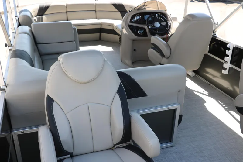Slide: The Image of Luxurious interior of 2021 Trifecta 24 RFC pontoon boat with plush seating and modern helm. - 21