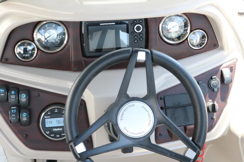 Slide: The Image of Steering console of 2021 Trifecta 24 RFC boat with gauges and controls. - 30