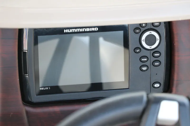 Slide: The Image of Humminbird Helix 5 fish finder on 2021 Trifecta 24 RFC boat dashboard. - 31