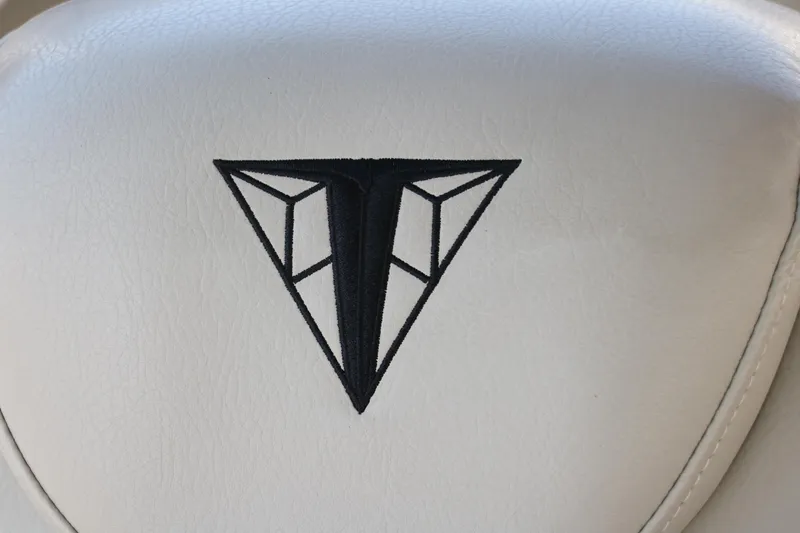 Slide: The Image of Embroidered Trifecta logo on white upholstery, 2021 Trifecta 24 RFC boat seat. - 34