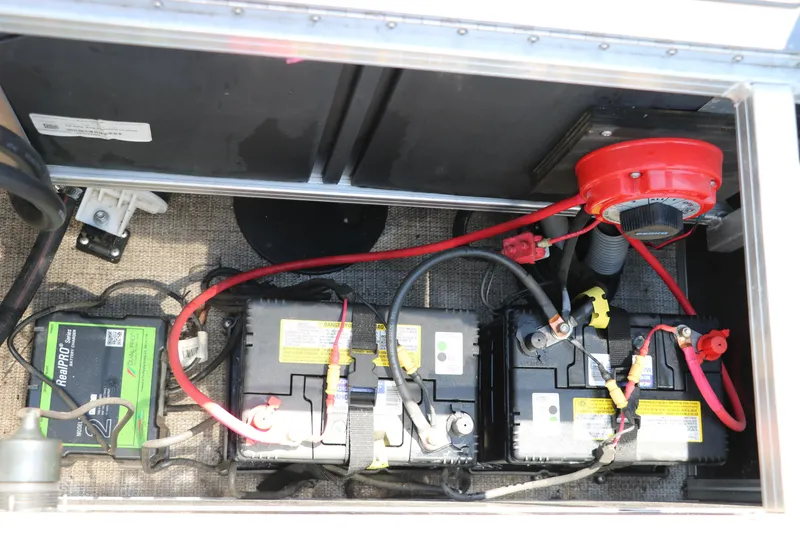 Slide: The Image of Battery compartment of 2021 Trifecta 24 RFC with wiring and components visible. - 35