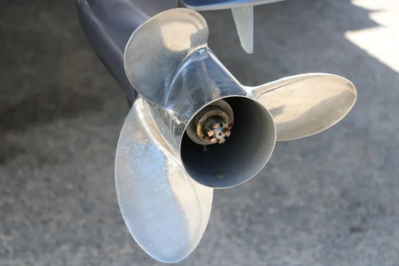 Slide: The Image of Close-up of a 2021 Trifecta 24 RFC boat propeller on a concrete surface. - 37
