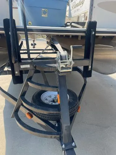 Slide: The Image of 2006 Bentley Pontoons 204 FISH trailer hitch with spare tire and winch. - 2
