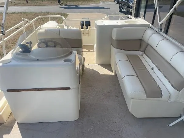 Slide: The Image of 2006 Bentley Pontoons 204 FISH interior with beige seating and helm station. - 5
