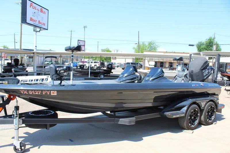 Slide: The Image of 2020 Skeeter FXR21 Apex boat on trailer at dealership. - 11