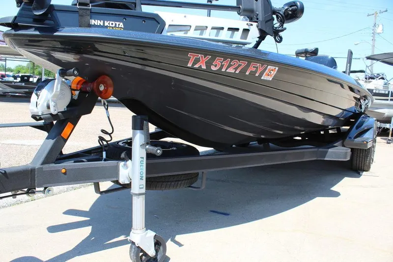 Slide: The Image of 2020 Skeeter FXR21 Apex boat on trailer, featuring Minn Kota motor. - 12