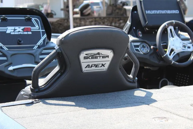 Slide: The Image of 2020 Skeeter FXR21 Apex boat interior with steering wheel and branded seat. - 14