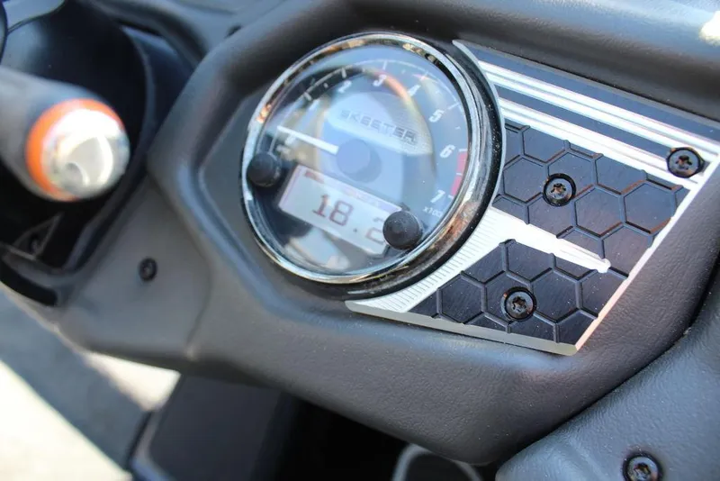 Slide: The Image of Dashboard of 2020 Skeeter FXR21 Apex boat with speedometer and hexagonal design. - 4