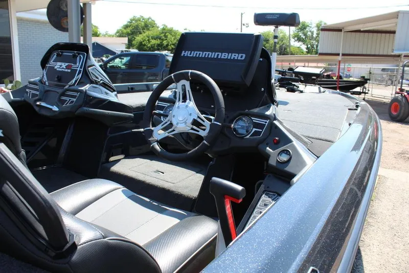 Slide: The Image of 2020 Skeeter FXR21 Apex boat interior with steering wheel and Humminbird electronics. - 5