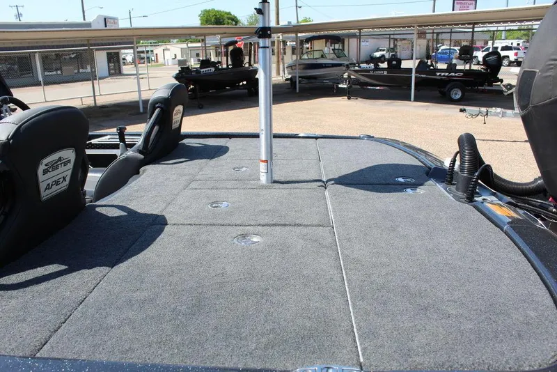 Slide: The Image of 2020 Skeeter FXR21 Apex boat deck with seating and storage compartments. - 6
