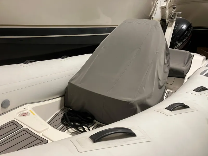 Slide: The Image of 2015 Brig Eagle 480 inflatable boat with covered console, stored indoors. - 0