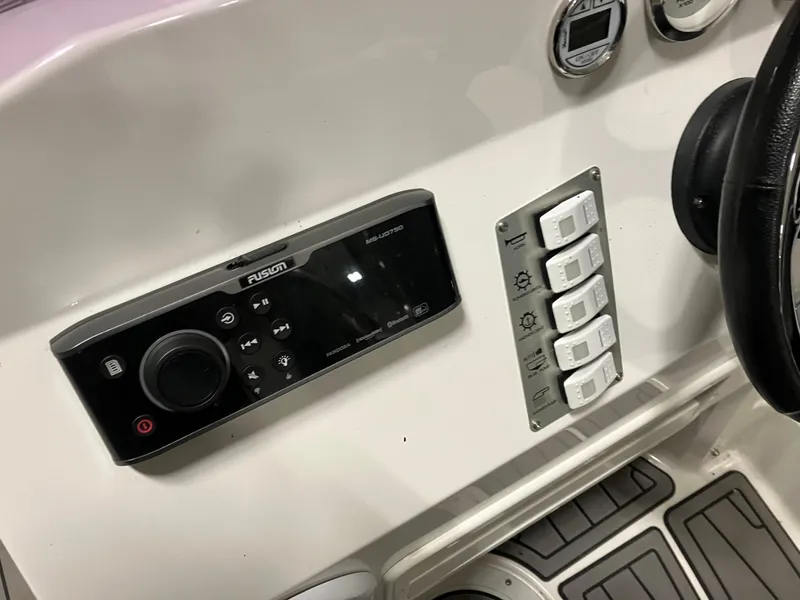 Slide: The Image of Control panel of 2015 Brig Eagle 480 boat with Fusion stereo system and switches. - 10