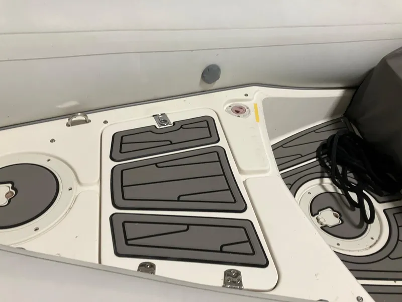 Slide: The Image of 2015 Brig Eagle 480 boat deck with storage compartments and non-slip surface. - 4