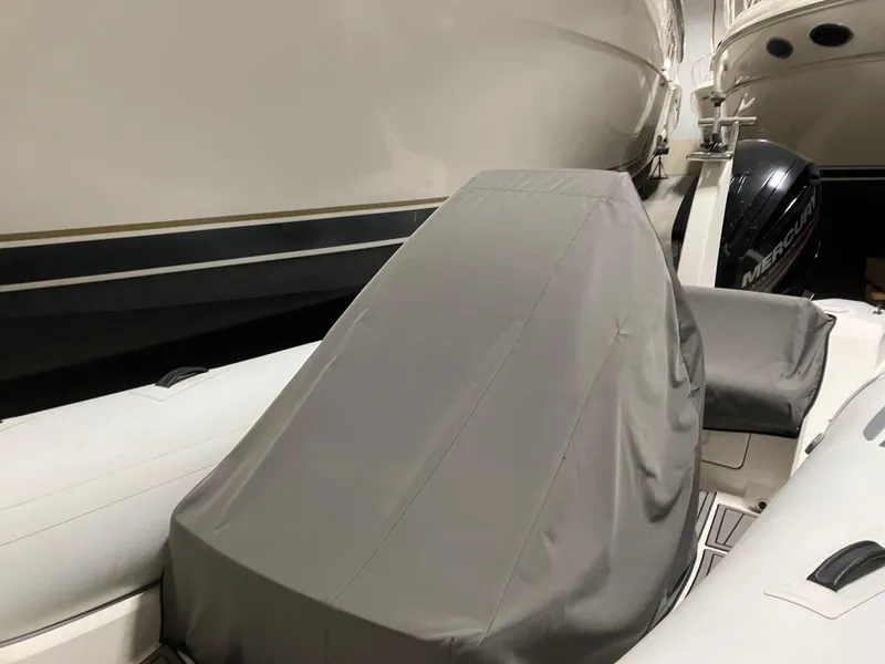 Slide: The Image of 2015 Brig Eagle 480 boat with cover, stored indoors. - 6