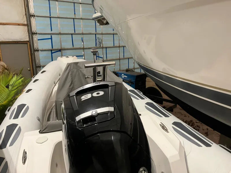 Slide: The Image of 2015 Brig Eagle 480 inflatable boat with 90 HP engine in storage. - 7