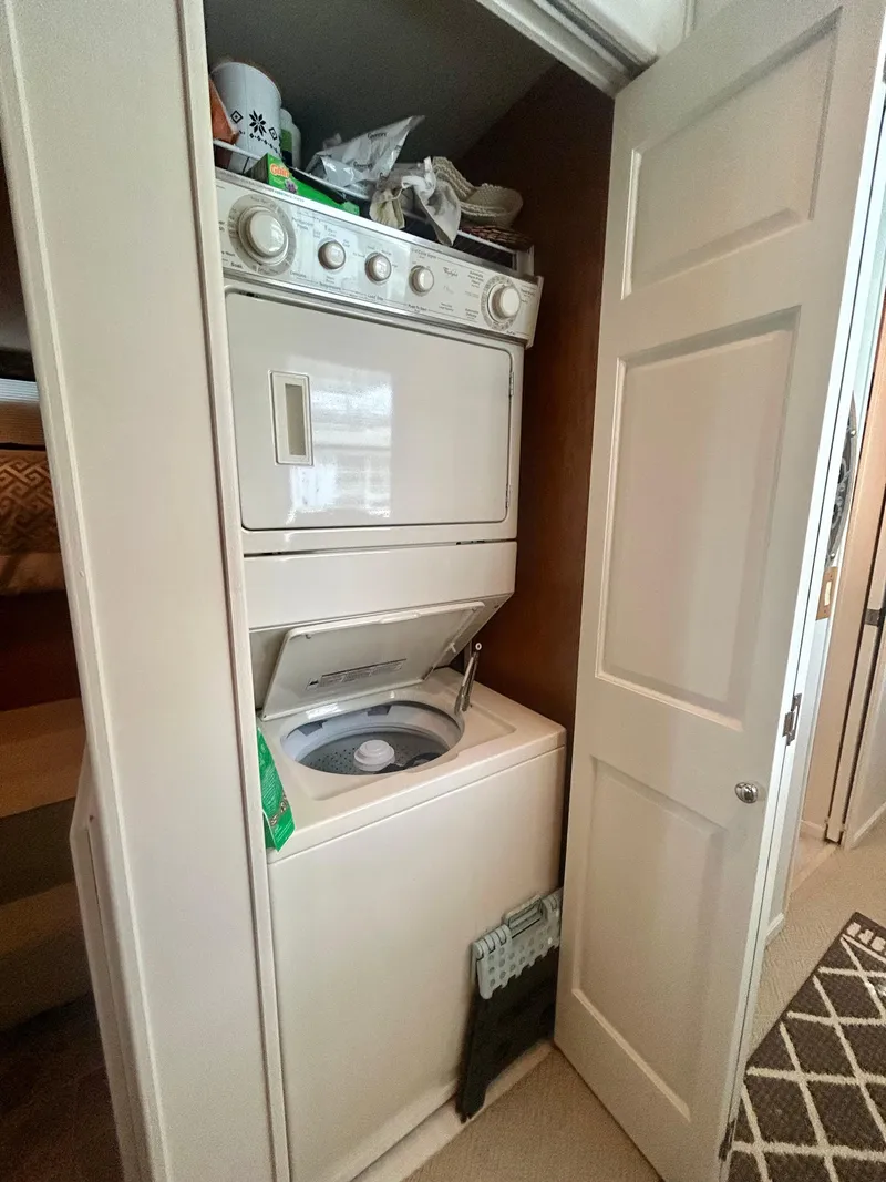 Slide: The Image of Stacked washer and dryer in 2002 Sumerset houseboat laundry area. - 16
