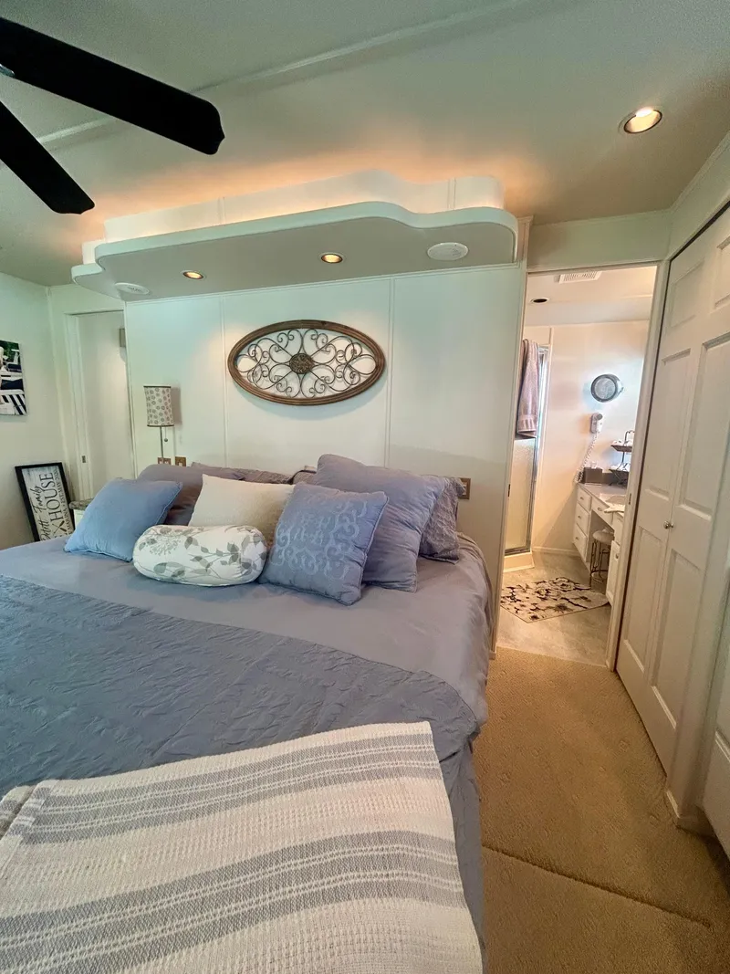 Slide: The Image of Cozy bedroom in a 2002 Sumerset houseboat with elegant decor and soft lighting. - 20