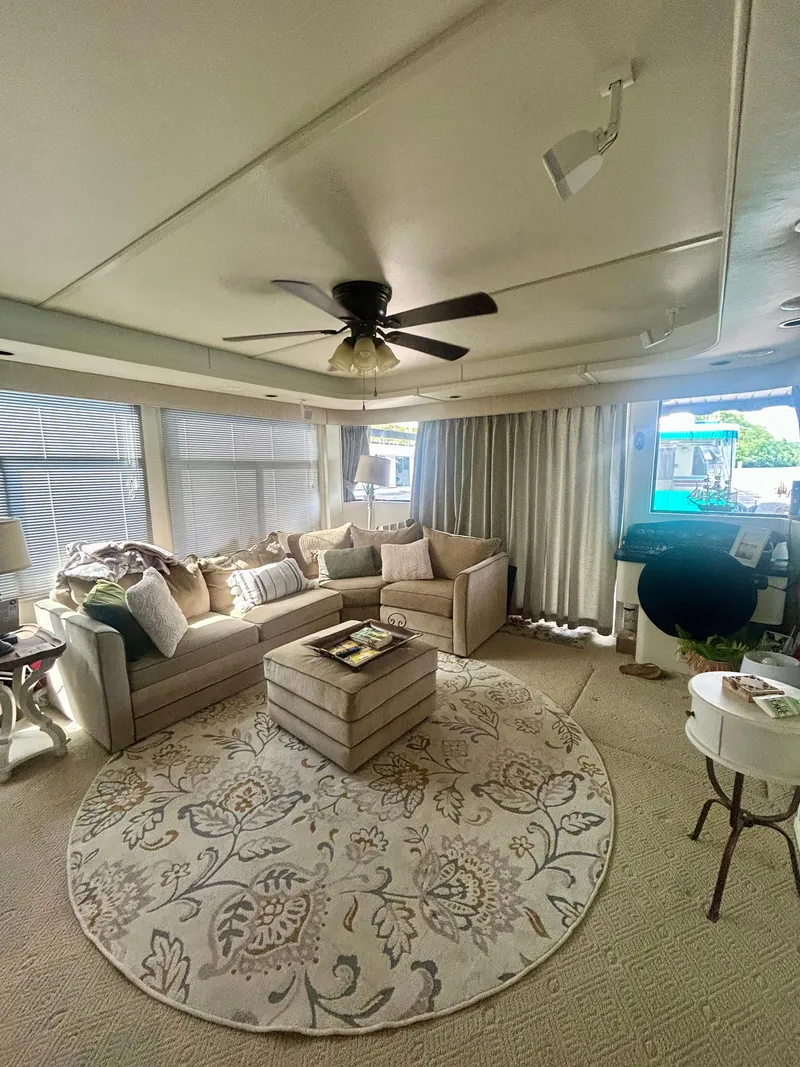 Slide: The Image of Cozy interior of a 2002 Sumerset houseboat with elegant furnishings and a floral rug. - 28