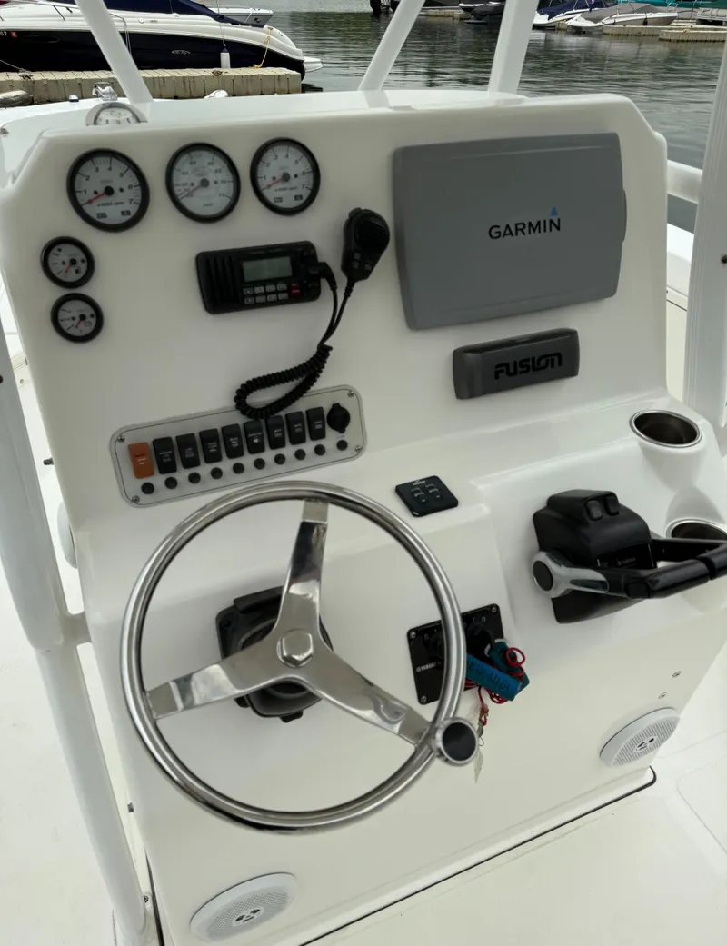 Slide: The Image of 2011 Tidewater 250CC Adventure helm with Garmin navigation, gauges, and controls. - 11