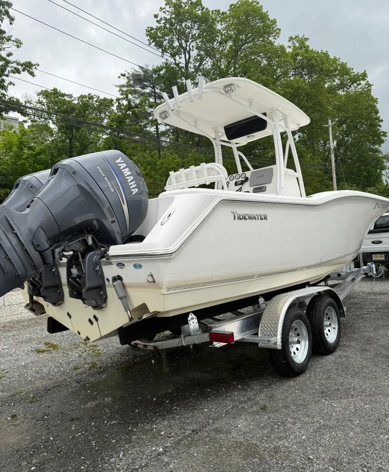 Slide: The Image of 2011 Tidewater 250CC Adventure boat with twin Yamaha engines on a trailer. - 14