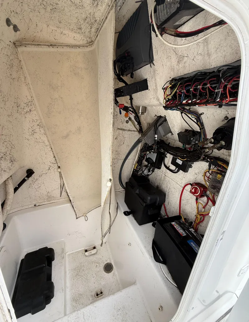Slide: The Image of 2011 Tidewater 250CC Adventure boat interior wiring and components. - 6