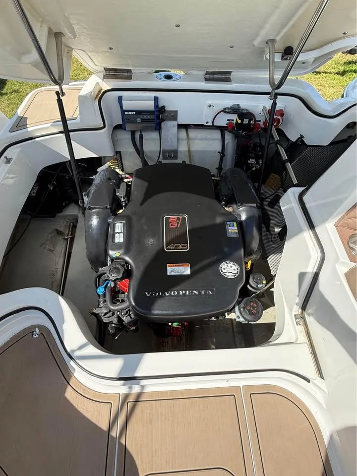 Slide: The Image of 2012 Cobalt 242 boat engine compartment with Volvo Penta engine. - 12