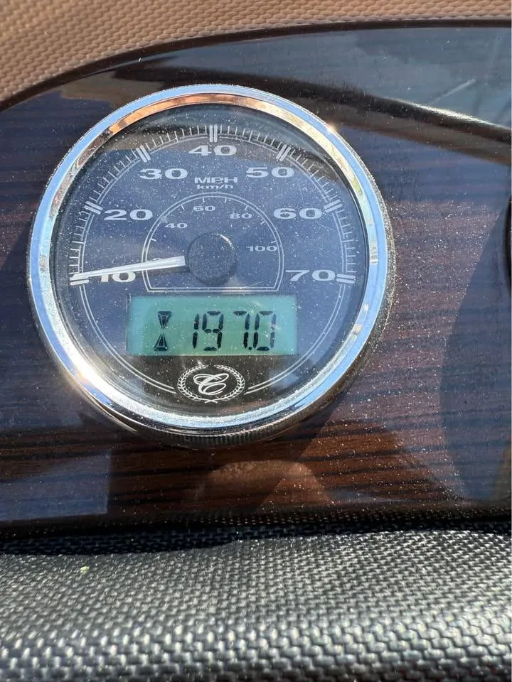 Slide: The Image of Speedometer of a 2012 Cobalt 242 showing 718.7 hours. - 13