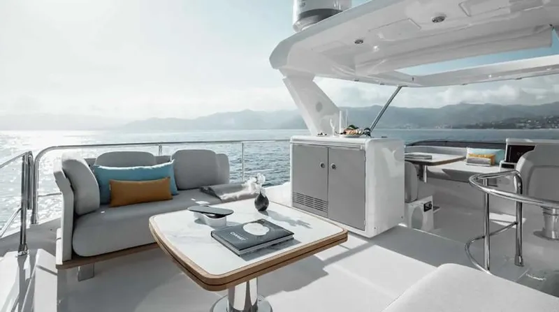 Slide: The Image of Luxurious 2024 Azimut 50 Fly yacht deck with elegant seating and ocean view. - 2