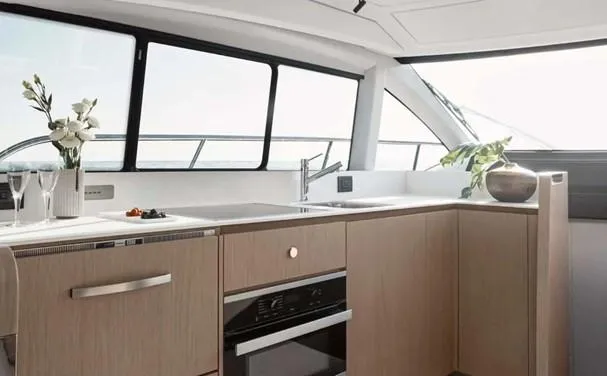 Slide: The Image of Luxurious kitchen interior of 2024 Azimut 50 Fly yacht with modern appliances and elegant decor. - 6