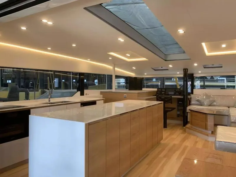 Slide: The Image of Luxurious interior of 2026 McConaghy MC55 yacht with modern kitchen and seating area. - 14