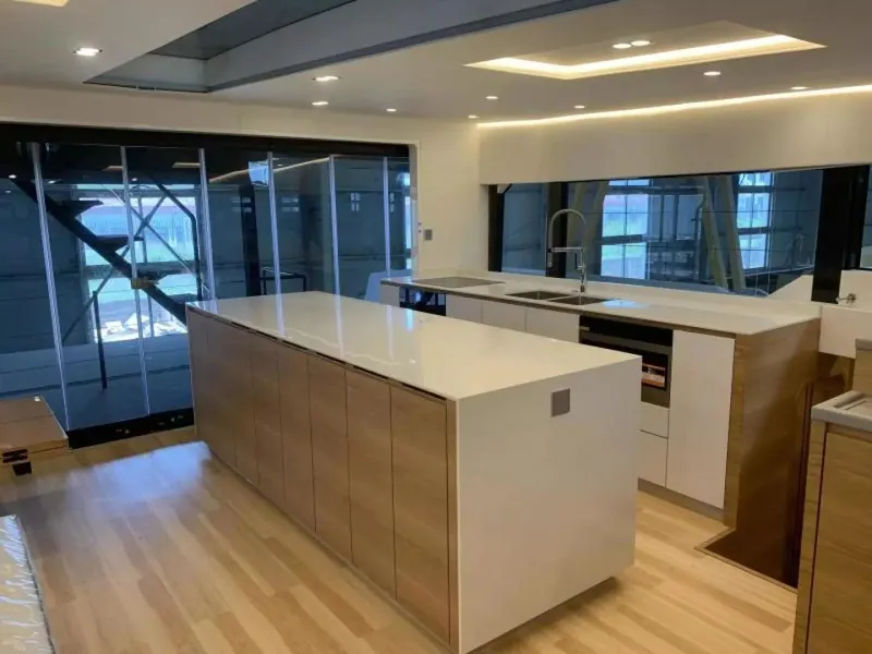 Slide: The Image of Modern kitchen interior on 2026 McConaghy MC55 yacht, featuring sleek design and wooden flooring. - 15