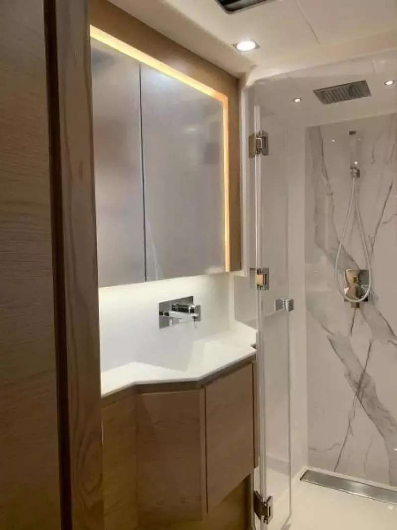 Slide: The Image of Luxurious bathroom interior of 2026 McConaghy MC55 yacht with modern fixtures and marble accents. - 21