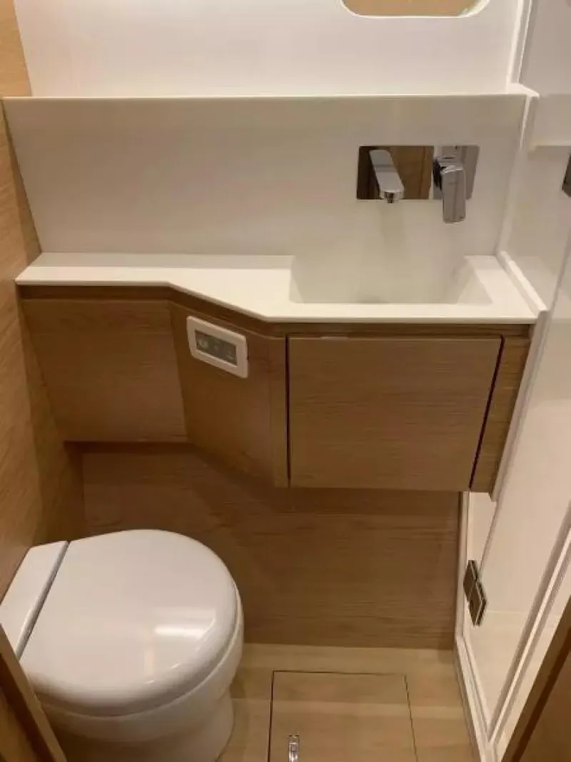 Slide: The Image of Modern bathroom in 2026 McConaghy MC55 yacht with sleek fixtures and wood accents. - 22