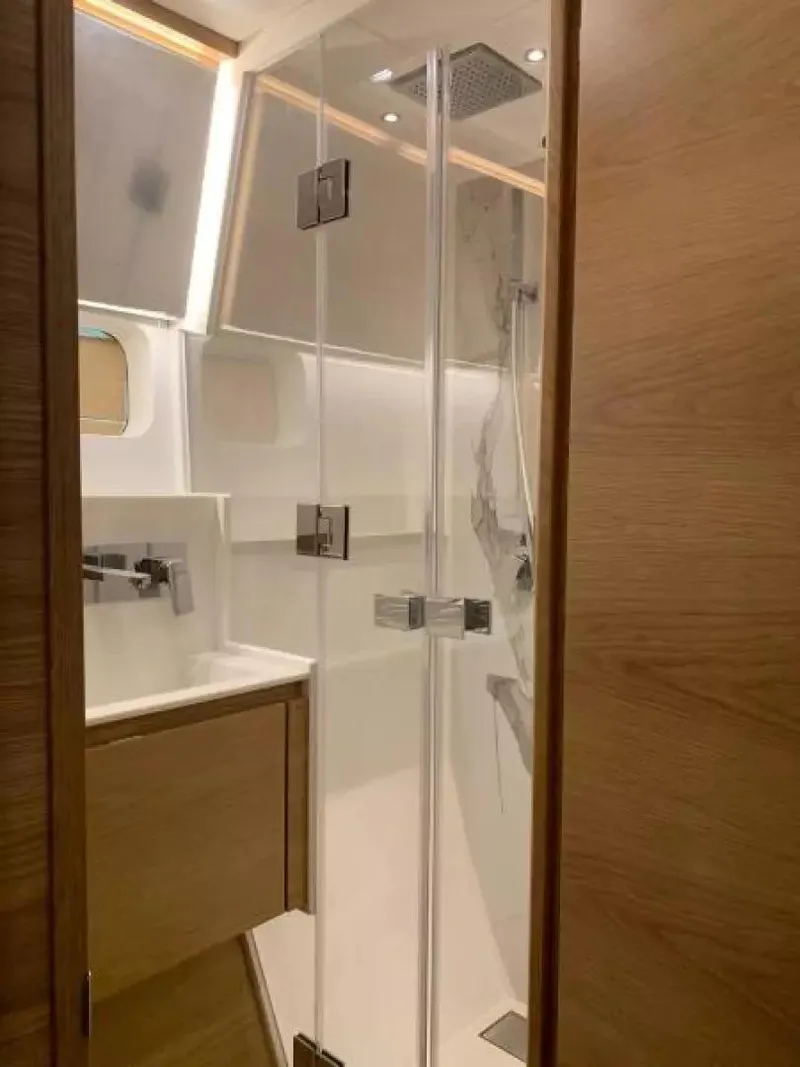 Slide: The Image of 2026 McConaghy MC55 yacht bathroom with modern shower and wooden cabinetry. - 23