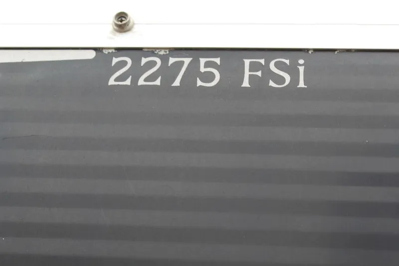 Slide: The Image of Close-up of 2010 Bennington 2275 Fish model label on boat exterior. - 1