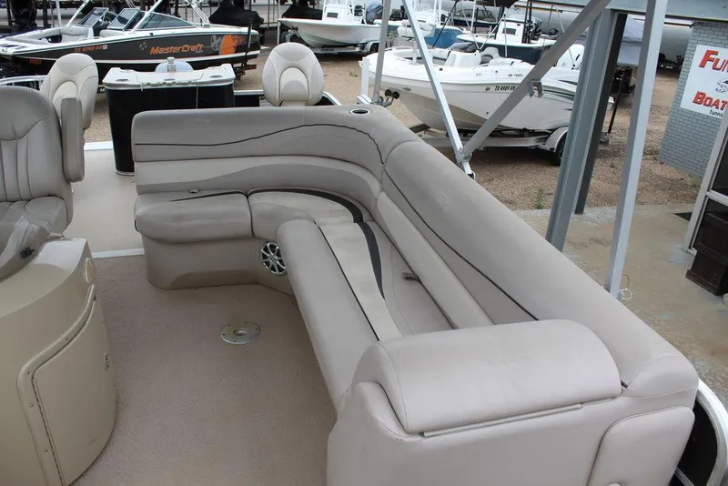 Slide: The Image of 2010 Bennington 2275 Fish boat interior with beige seating and modern design. - 13