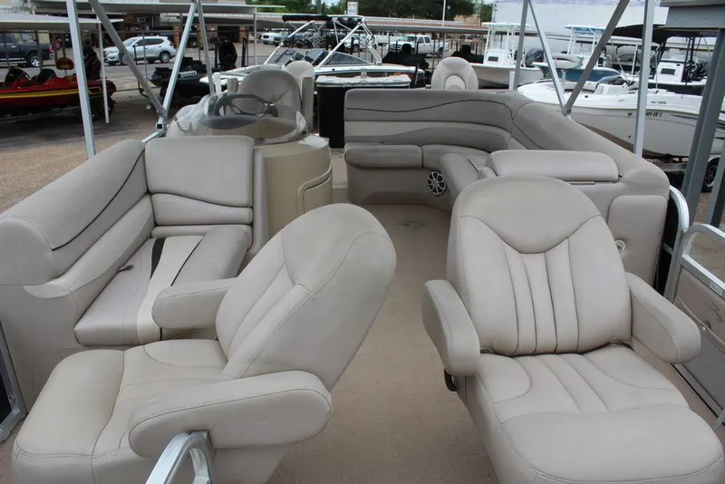 Slide: The Image of 2010 Bennington 2275 Fish pontoon boat with beige seating and spacious layout. - 16