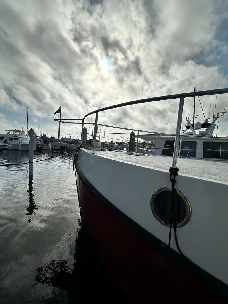 Slide: The Image of Great Harbour N37 boat docked under cloudy sky, 2005 model. - 11