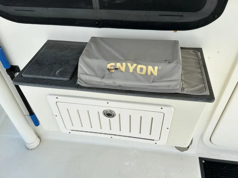 Slide: The Image of Boat deck with storage compartment and covered equipment on Great Harbour N37, 2005 model. - 15