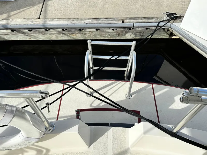 Slide: The Image of Great Harbour N37 boat stern with ladder and dock lines, 2005 model. - 17