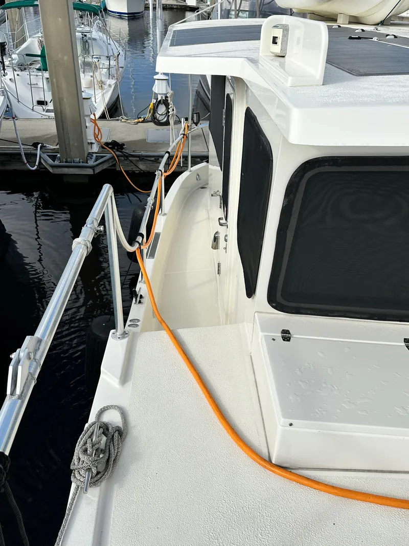 Slide: The Image of 2005 Great Harbour N37 boat docked with visible deck and railing. - 25