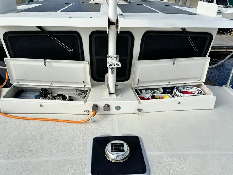 Slide: The Image of 2005 Great Harbour N37 boat deck with open storage compartments and visible equipment. - 27