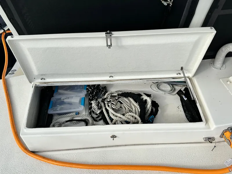 Slide: The Image of Storage compartment on a 2005 Great Harbour N37 boat, containing ropes and equipment. - 29