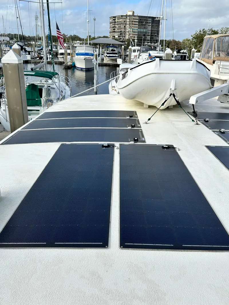 Slide: The Image of 2005 Great Harbour N37 boat with solar panels docked at a marina. - 32