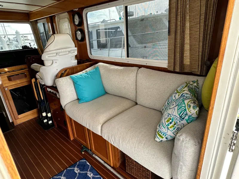 Slide: The Image of Interior of 2005 Great Harbour N37 yacht with cozy seating and decorative pillows. - 37
