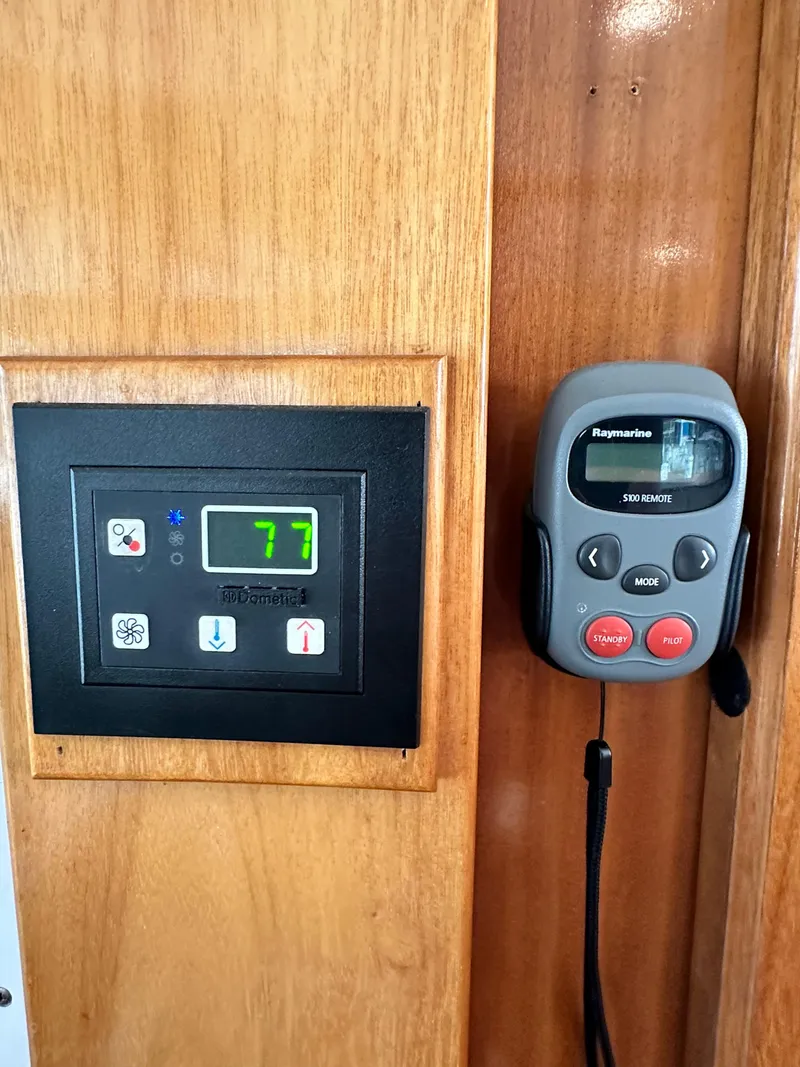 Slide: The Image of Control panel and Raymarine remote on 2005 Great Harbour N37 yacht. - 41
