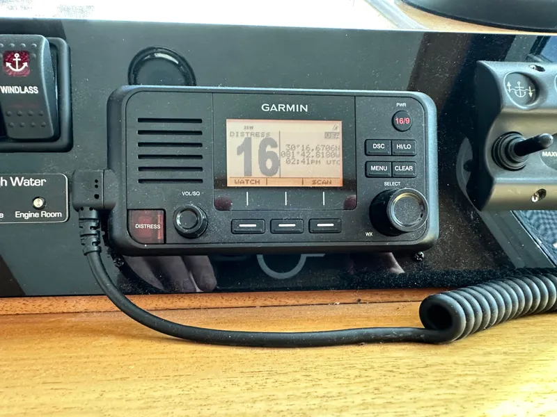 Slide: The Image of Garmin marine radio on 2005 Great Harbour N37 boat dashboard, displaying distress channel. - 44